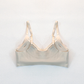 Dos d'une brassière beige sans coutures montrant les larges bretelles réglables et l'absence d'agrafes pour un confort total sans irritations.